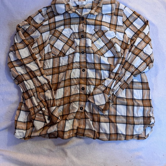 Stylish plaid button-up shirt with a classic design. Features a mix of brown and - Picture 2 of 8
